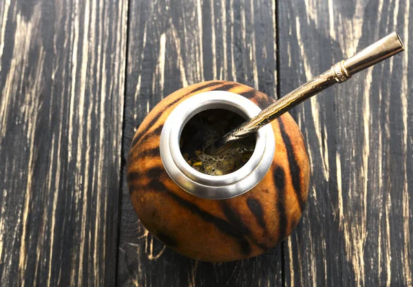 Yerba mate tea in a wooden mate calabash