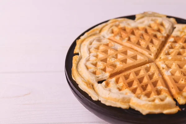 Homemade heart shaped waffles in iron waffle pan — Stock Photo, Image