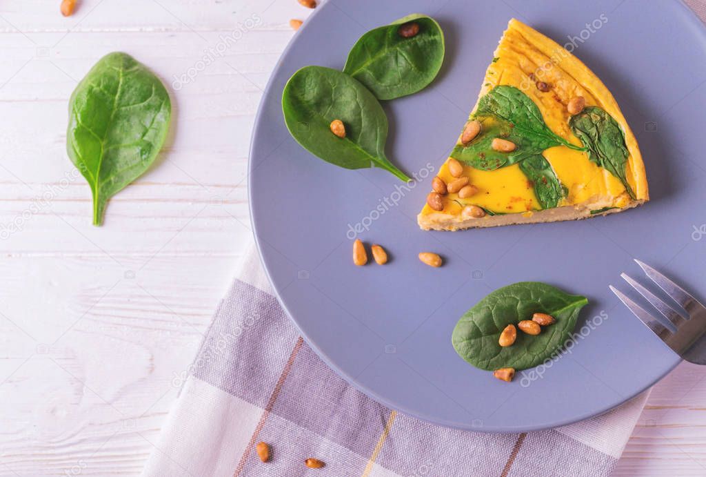 frittata with eggs, spinach, cheese and pine nuts