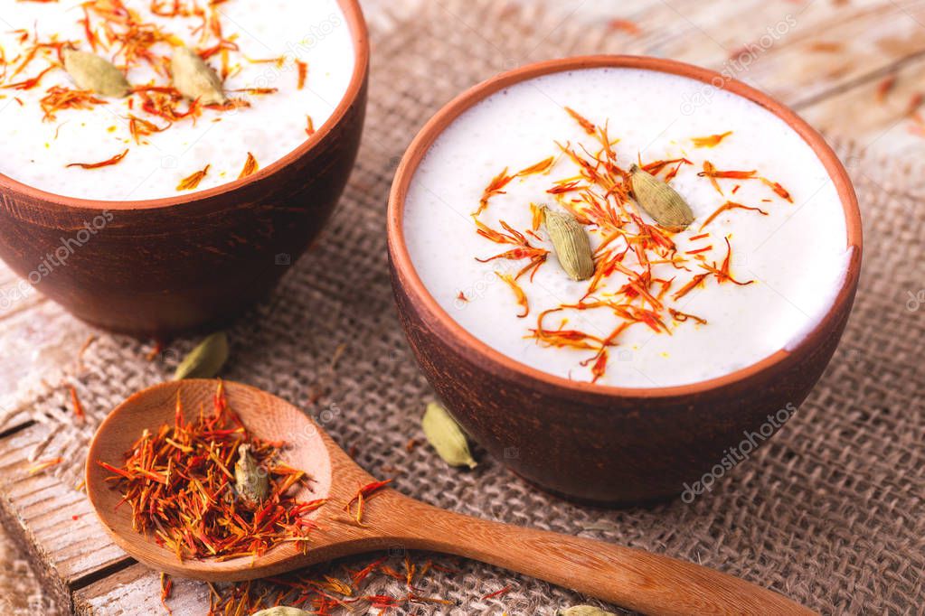 Traditional Indian lassi curd with cardamon and saffron. 