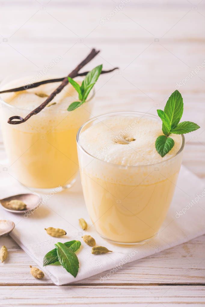 Traditional Indian mango lassi with cardamon, mint, vanilla and 