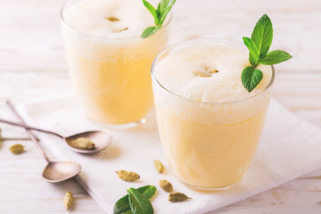 Traditional Indian mango lassi with cardamon, mint, vanilla and 