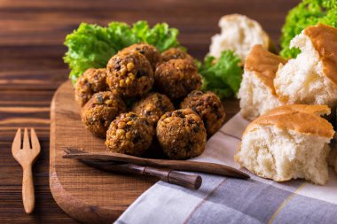 Homemade falafel with salad. Jewish Cuisine. Horizontal view clipart