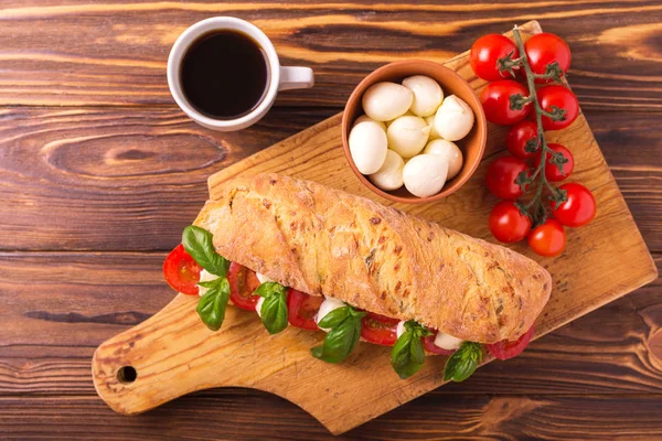 Ciabatta sandwich with caprese salad with coffee. — Stock Photo, Image