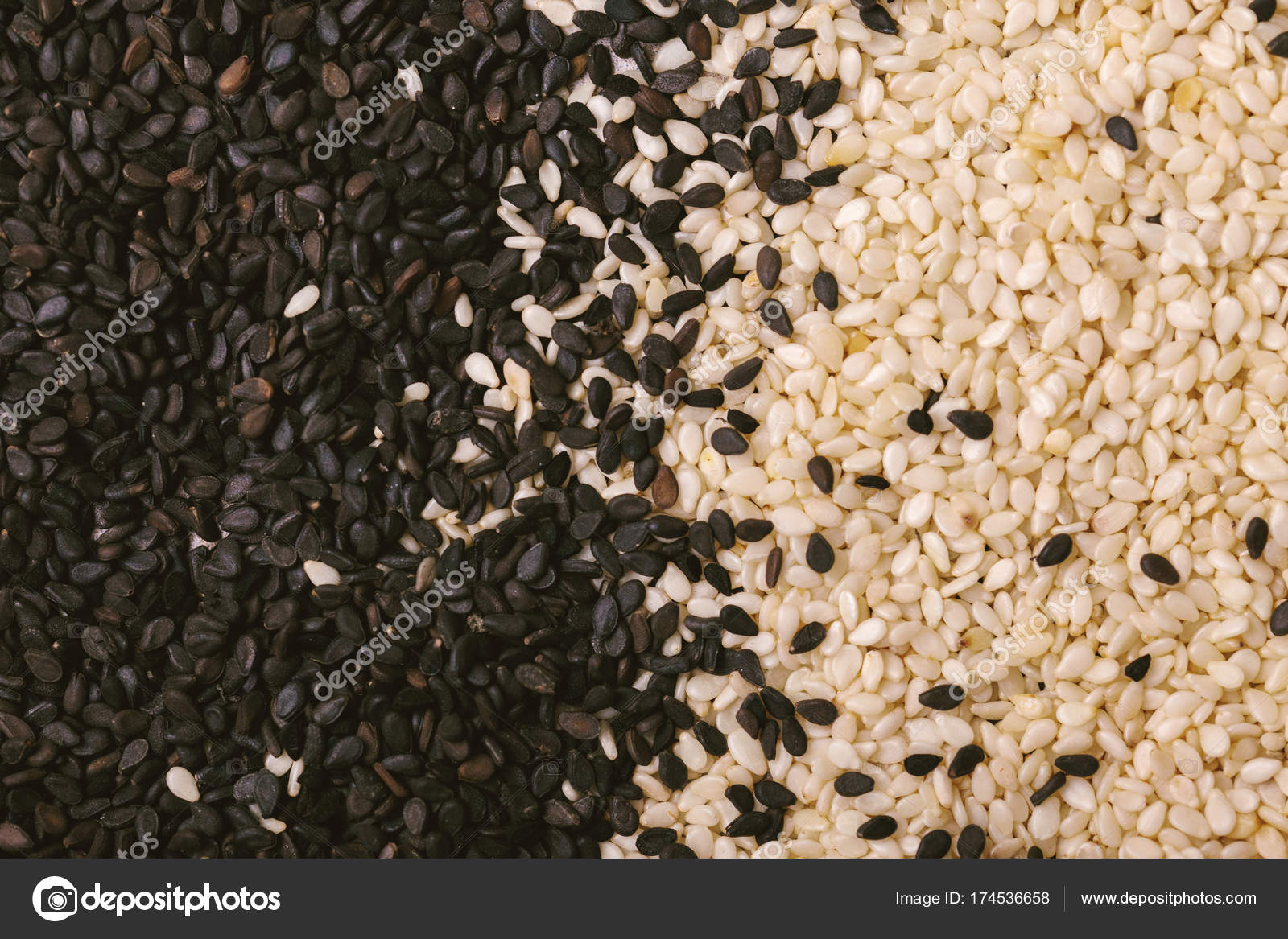 Black and white sesame seeds. Copy space. Top view. Stock Photo by