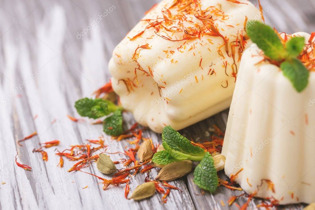 Indian kulfi dessert, ice cream with safron, mint, nuts