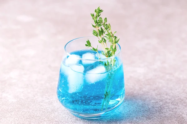 Ice Blue cocktail with thyme. Blue curacao liqueur. Summer — Stock Photo, Image