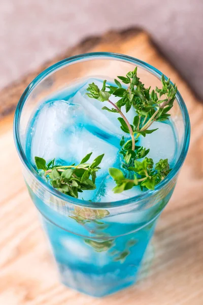 Ice Blue cocktail with thyme. Blue curacao liqueur. Summer — Stock Photo, Image