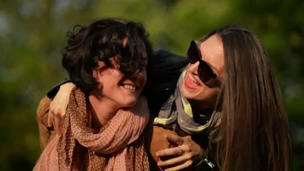 Amazing Woman With Short Curly Hair Is Carrying Her Female Friend