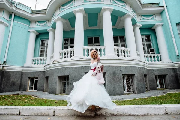 Beautiful bride with tattoo at wedding morning