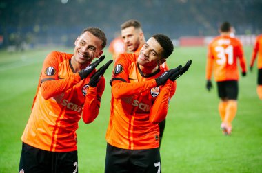 Kharkiv, Ukraine - February 20, 2020:  Alan Patrik and Taison happy and fun celebrating goal in match Europa League Shakhtar - Benfica