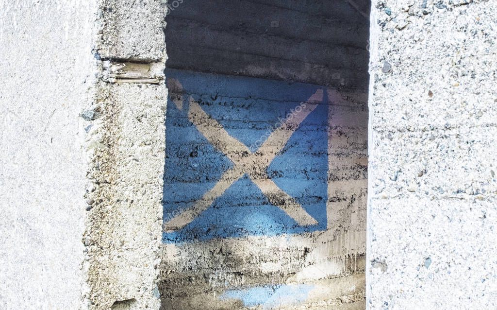 Scottish flag painted on concrete wall