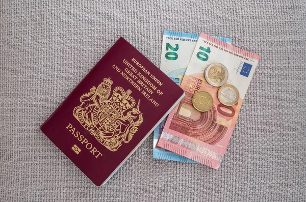 British passport with Euro currency