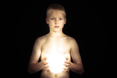 Boy with glowing bowl of light clipart