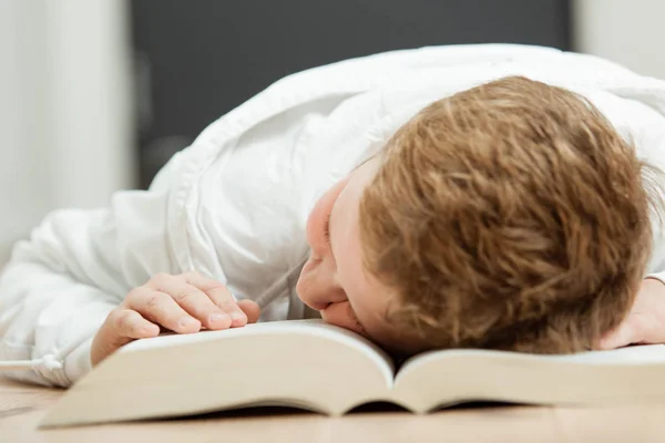 Schoolboy tired of doing homework — Stock Photo, Image