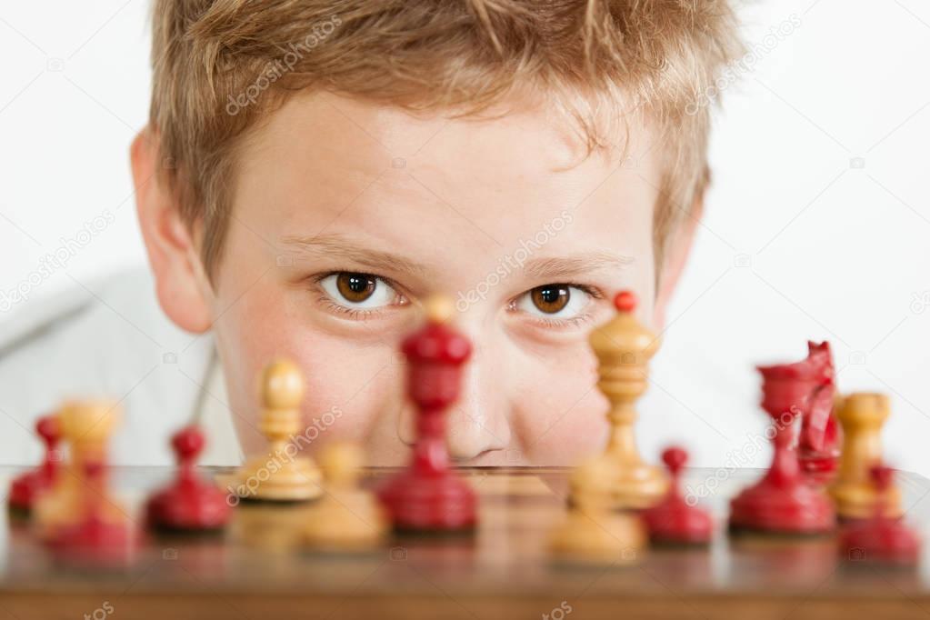 Boy playing chess