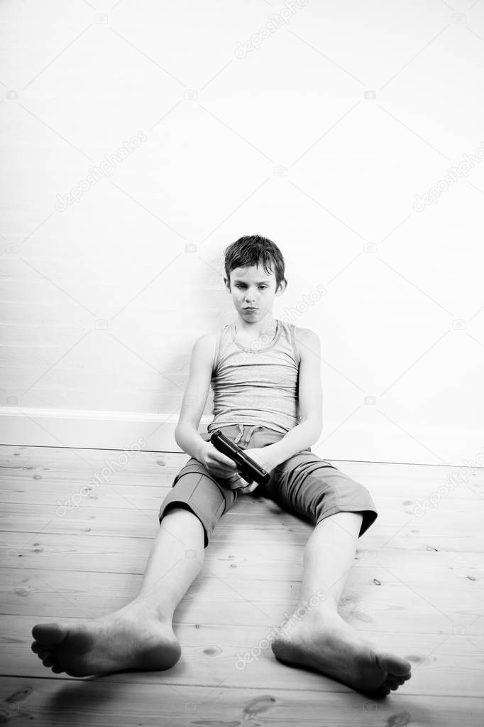 Boy holding a handgun