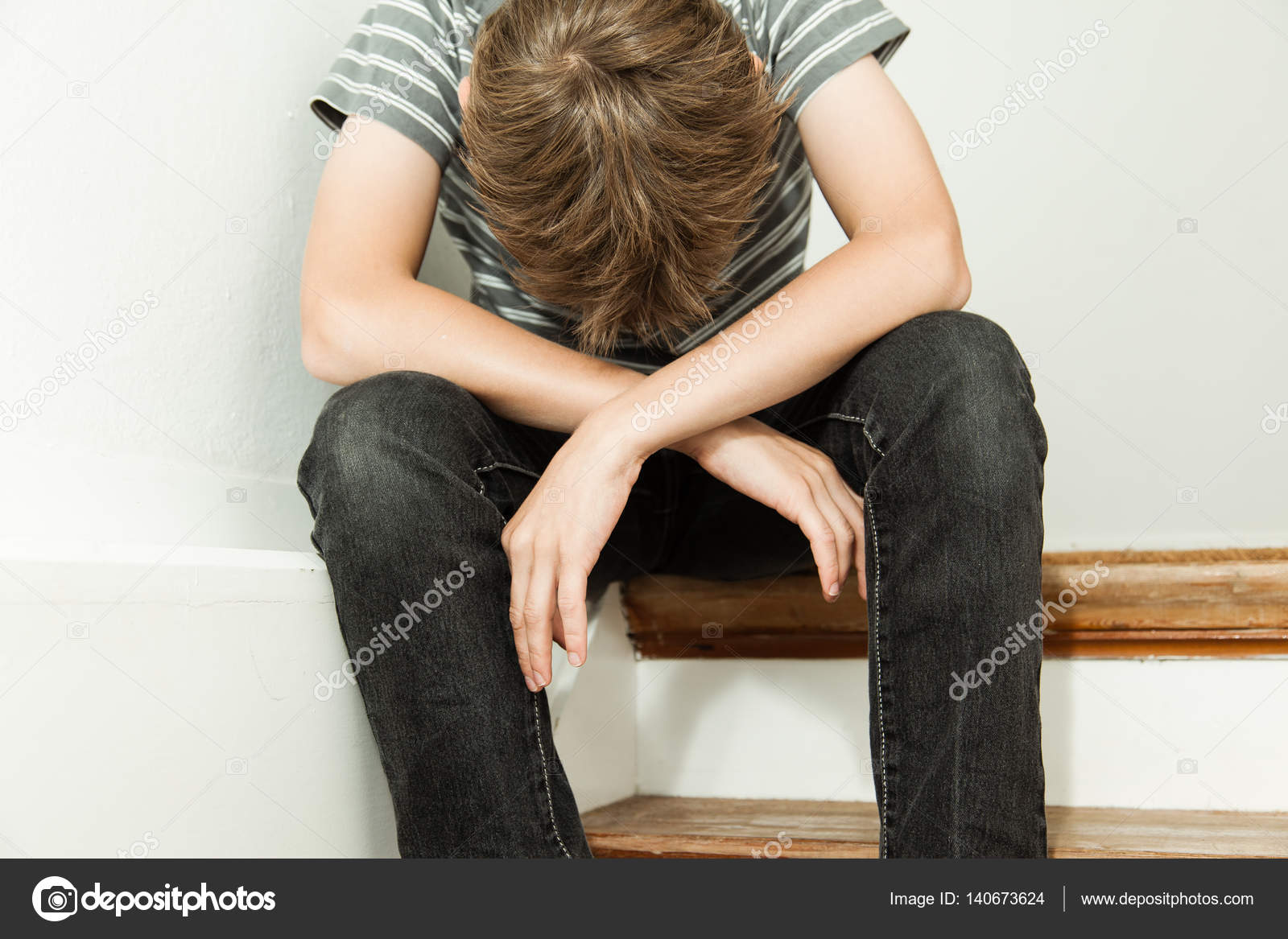 Boy crying while sitting on the stairs Stock Photo by ©jhandersen ...