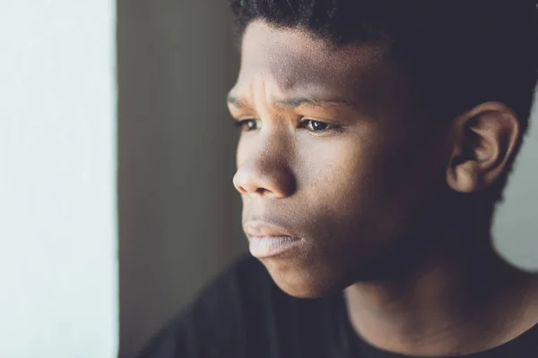 Faded retro portrait of a worried African boy — Stock Photo, Image