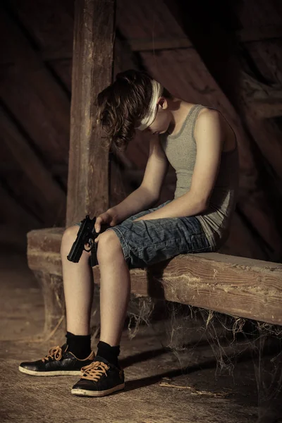 Barefoot boy imprisoned in a straight jacket — Stock Photo 