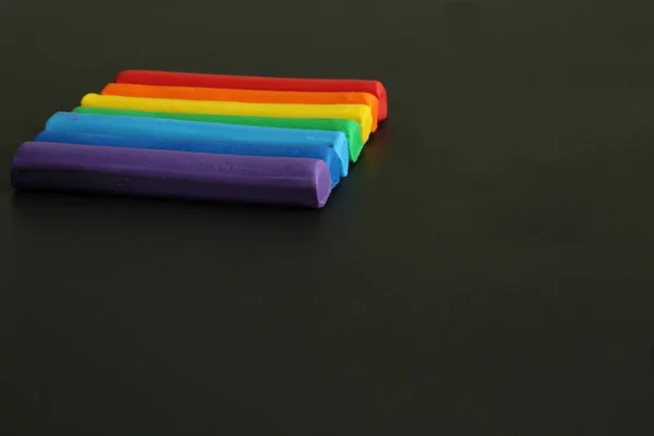 Plasticine lgbt rainbow black background — Stock Photo, Image