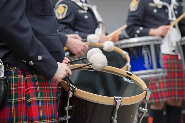 Young celtic drummers kilts closeup