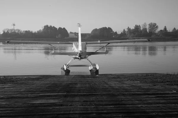 Black and white seaplane ready for flight water background — Stock Photo, Image