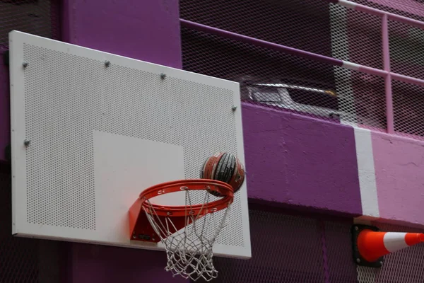 Ball falling basket closeup