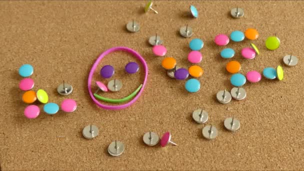 Stop motion push pins forming word love — Stock Video