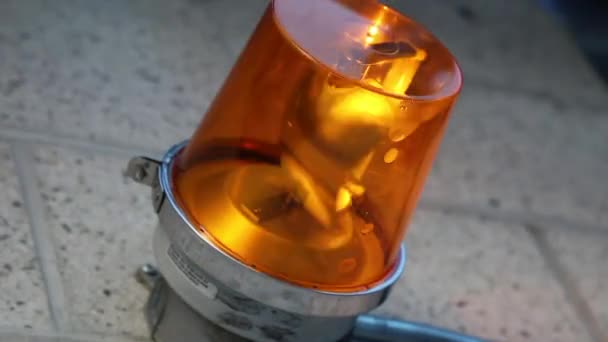 Orange beacon turning close seup background detail — стоковое видео