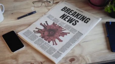 Medya bilgi gazetesi masasının ön sayfasında Corona virüsü resmi yayıyor 