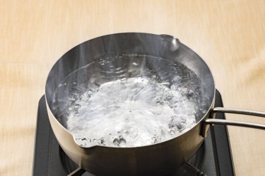 Boiling water in the pot clipart