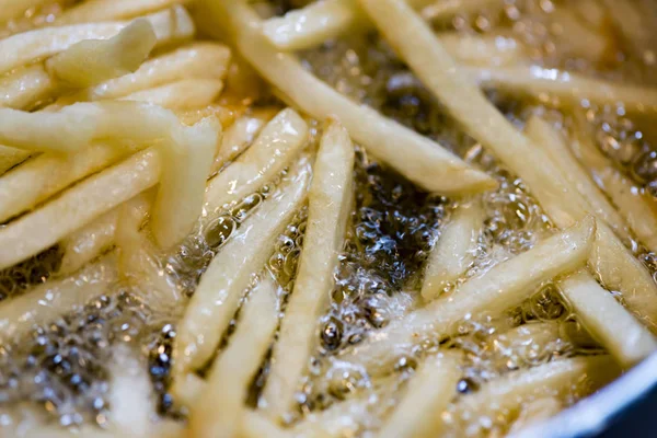 Fry fried potatoes with oil — Stock Photo, Image