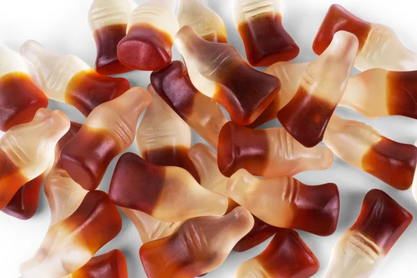 Cola flavored gummy jellies in the shape of cola bottles,backgro — Stock Photo, Image