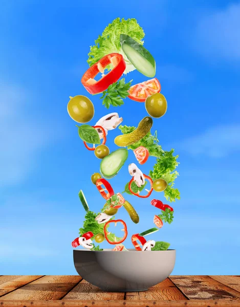 Flying salad isolated on wooden background. — Stock Photo, Image