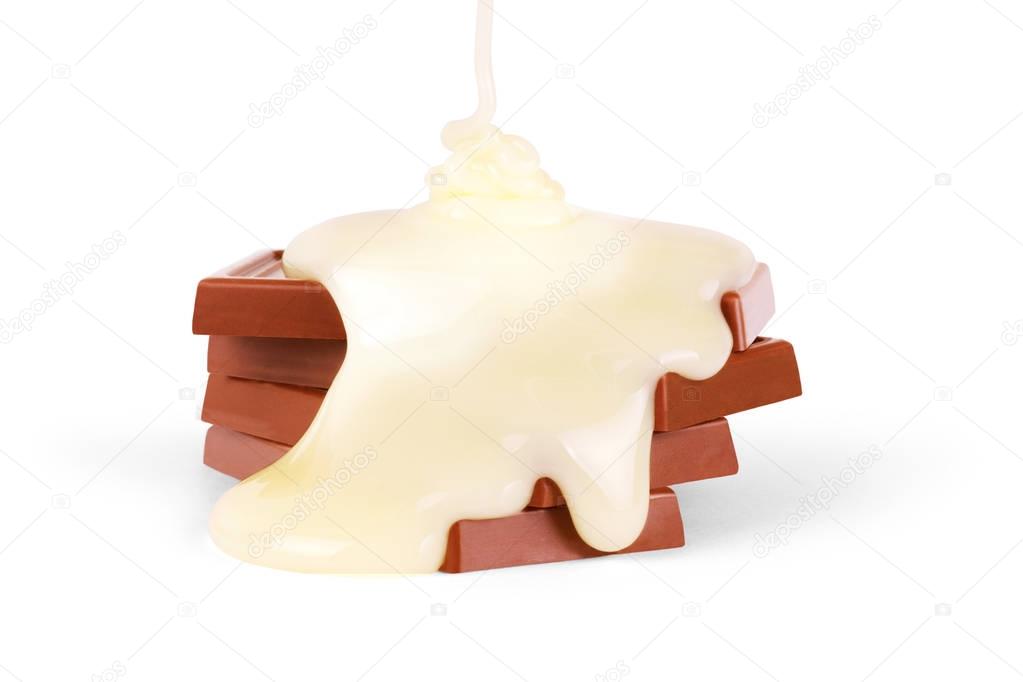 sweet milk sauce is poured on a chocolate bar