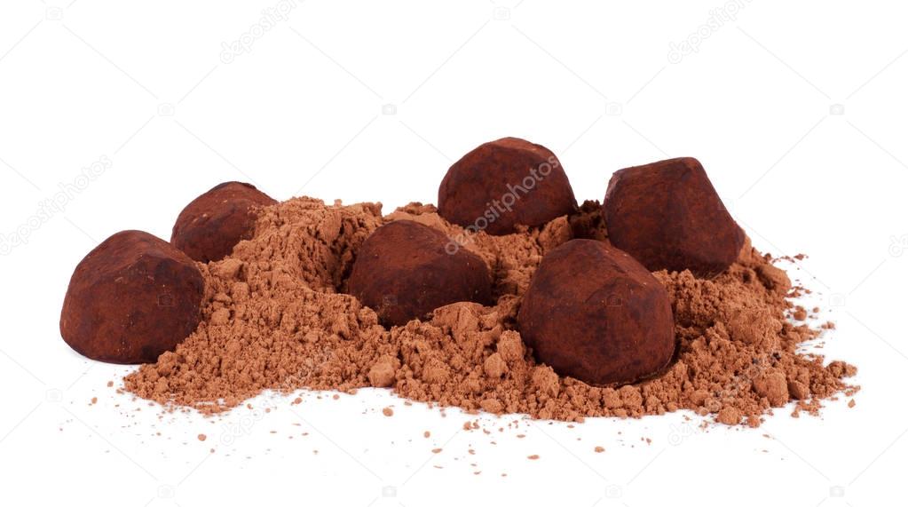 Chocolate truffles and cocoa isolated on white