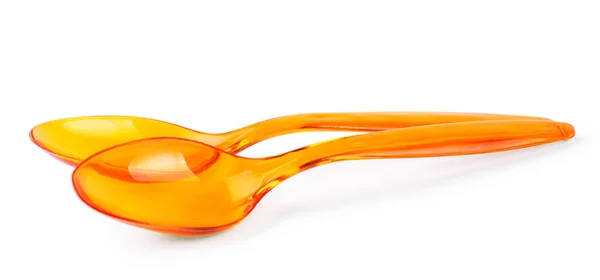 Cuchara de plástico naranja aislada sobre fondo blanco —  Fotos de Stock