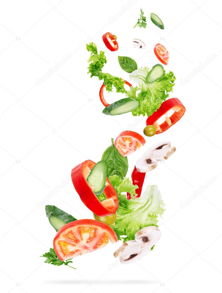 flying salad isolated on wooden background.