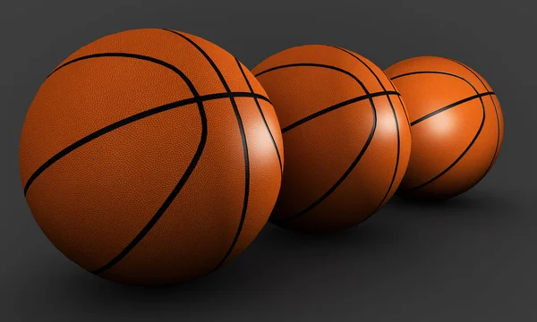 Three basketballs on a gray background