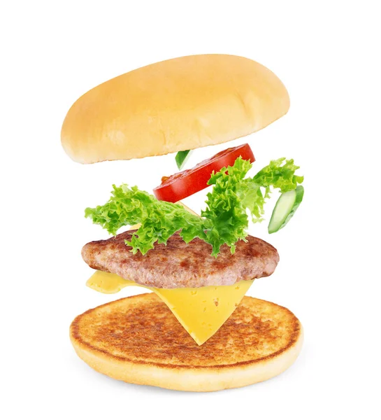 Burger components in flight on white background — Stock Photo, Image