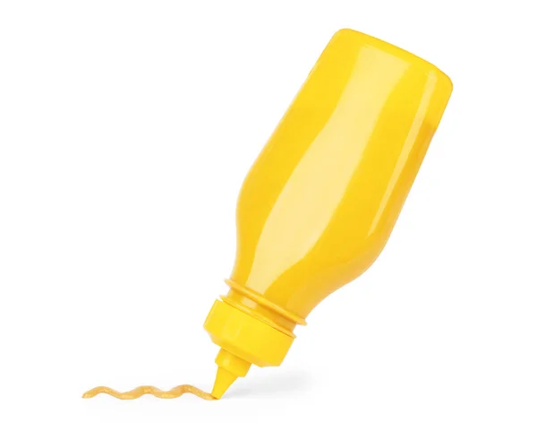 Beyaz bir arka plan sarı hardal şişesi — Stok fotoğraf