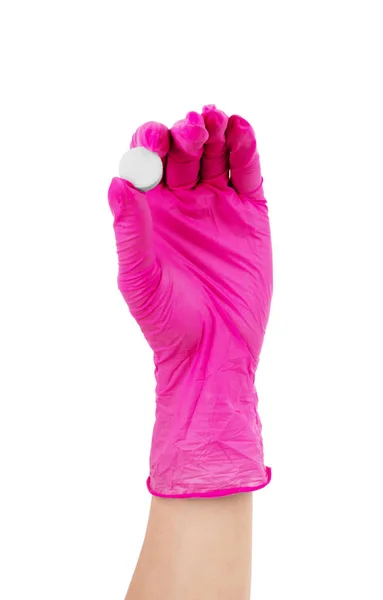 Mani in guanti di gomma che tengono pillole su sfondo bianco — Foto Stock