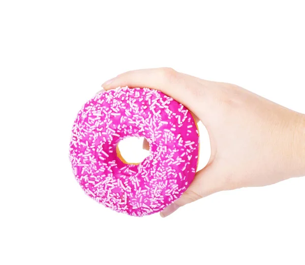 Donut in een vrouwelijke hand op een witte achtergrond — Stockfoto
