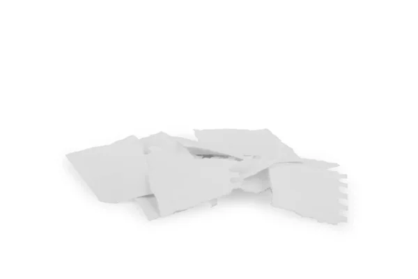 Folha rasgada de papel em pedaços sobre um fundo branco — Fotografia de Stock