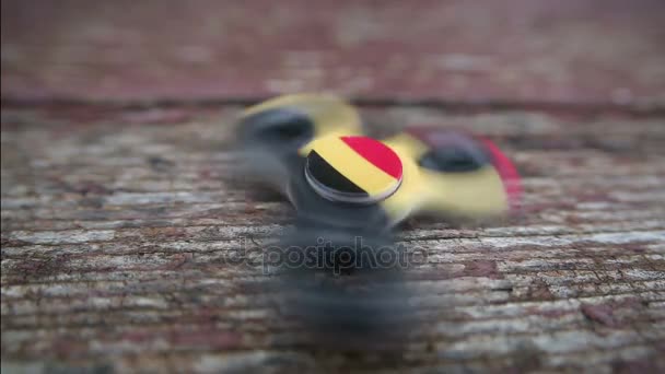 Fidget spinner close-up wiev on wooden background — Stock Video