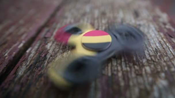 Fidget spinner close-up wiev on wooden background — Stock Video