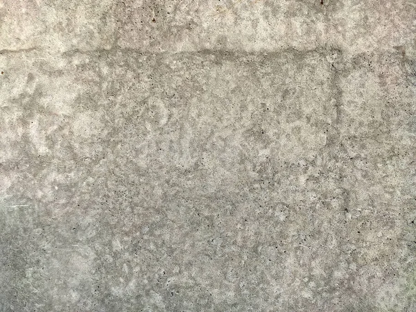 Šedá betonová textura stará zeď se škrábanci a prasklinami — Stock fotografie