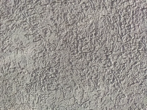 La texture du plâtre est le coléoptère de l'écorce sur le mur. Texture sans couture . — Photo