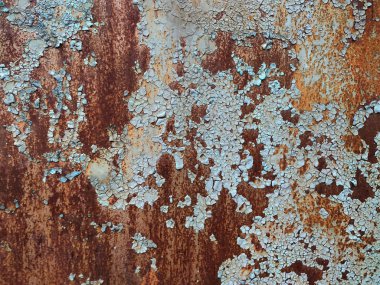 Aşınmış metal zemin. Paslı metal arka planda pas izleri var. Pas lekeleri. Rystycorrosion.